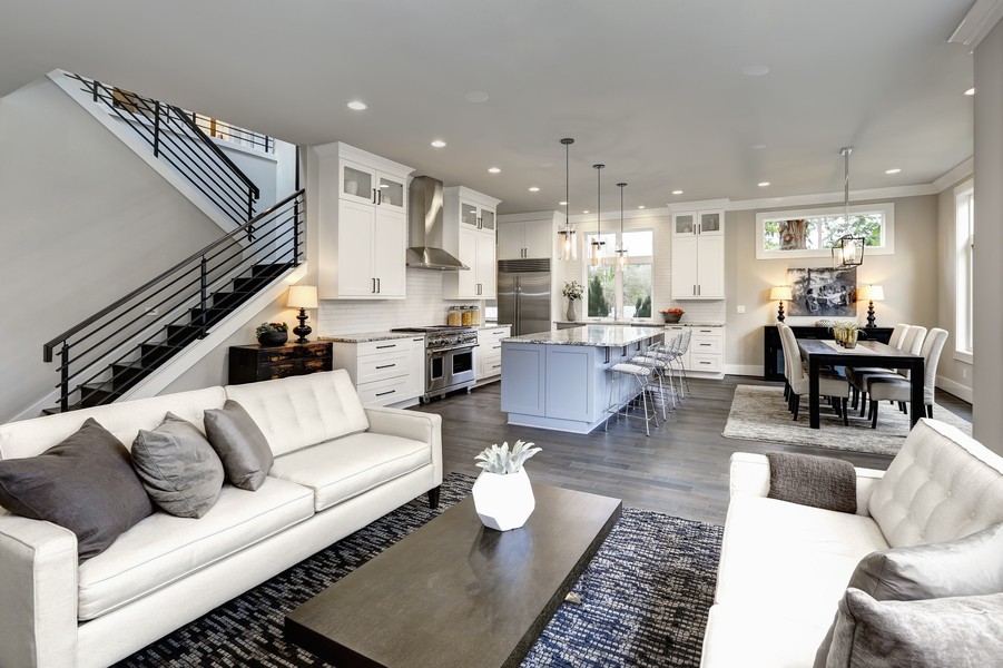 A home with an open floor plan and in-ceiling speakers.