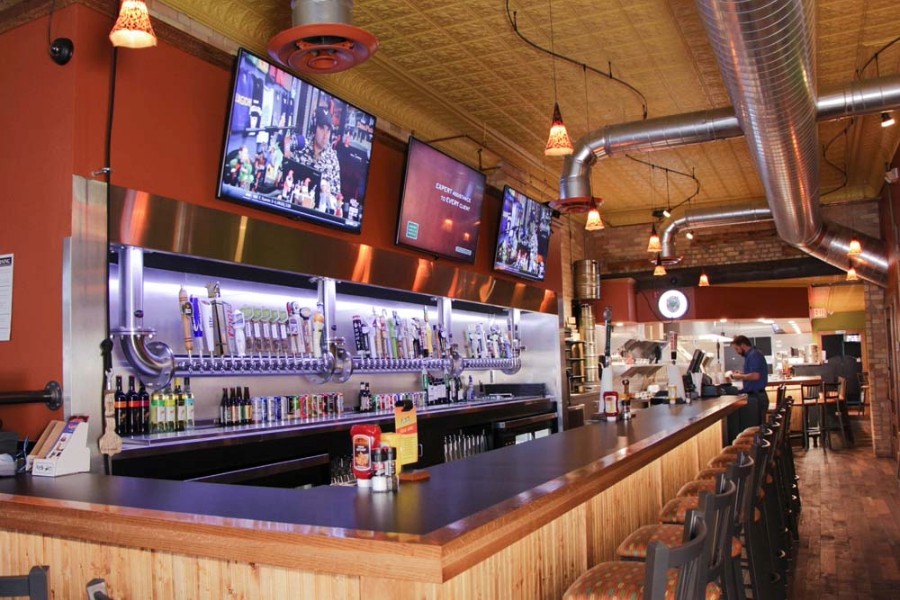 A bar featuring multiple TV screens for sports and entertainment.