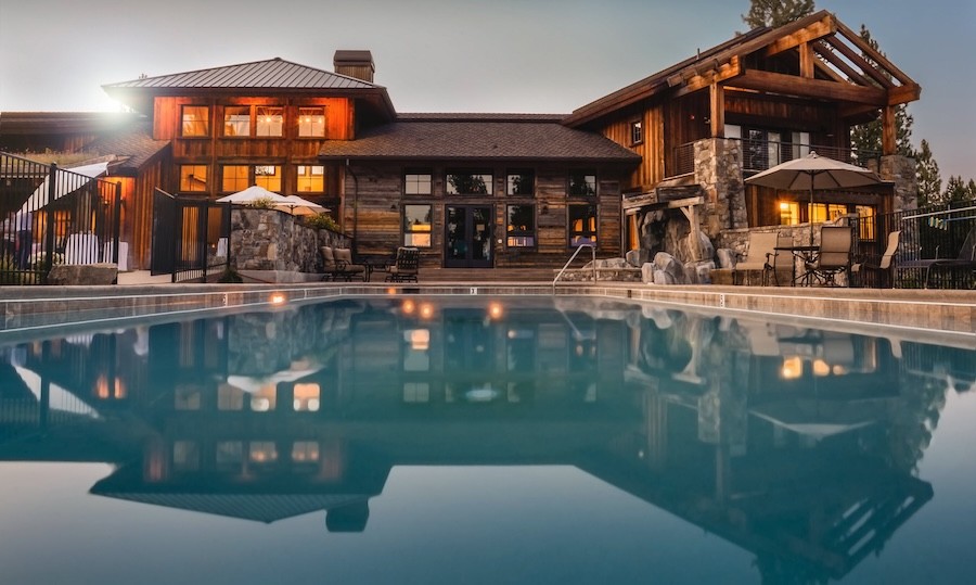 A luxury lake cabin with a pool.