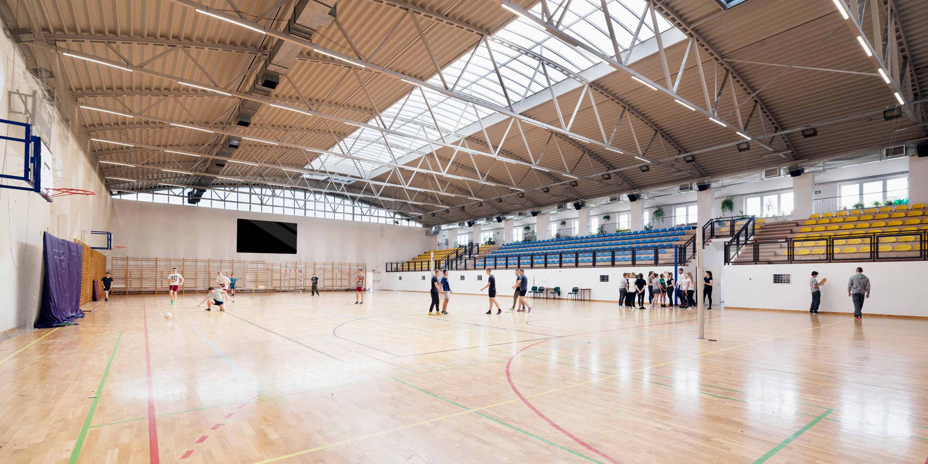 gymnasium with younger kids playing sports