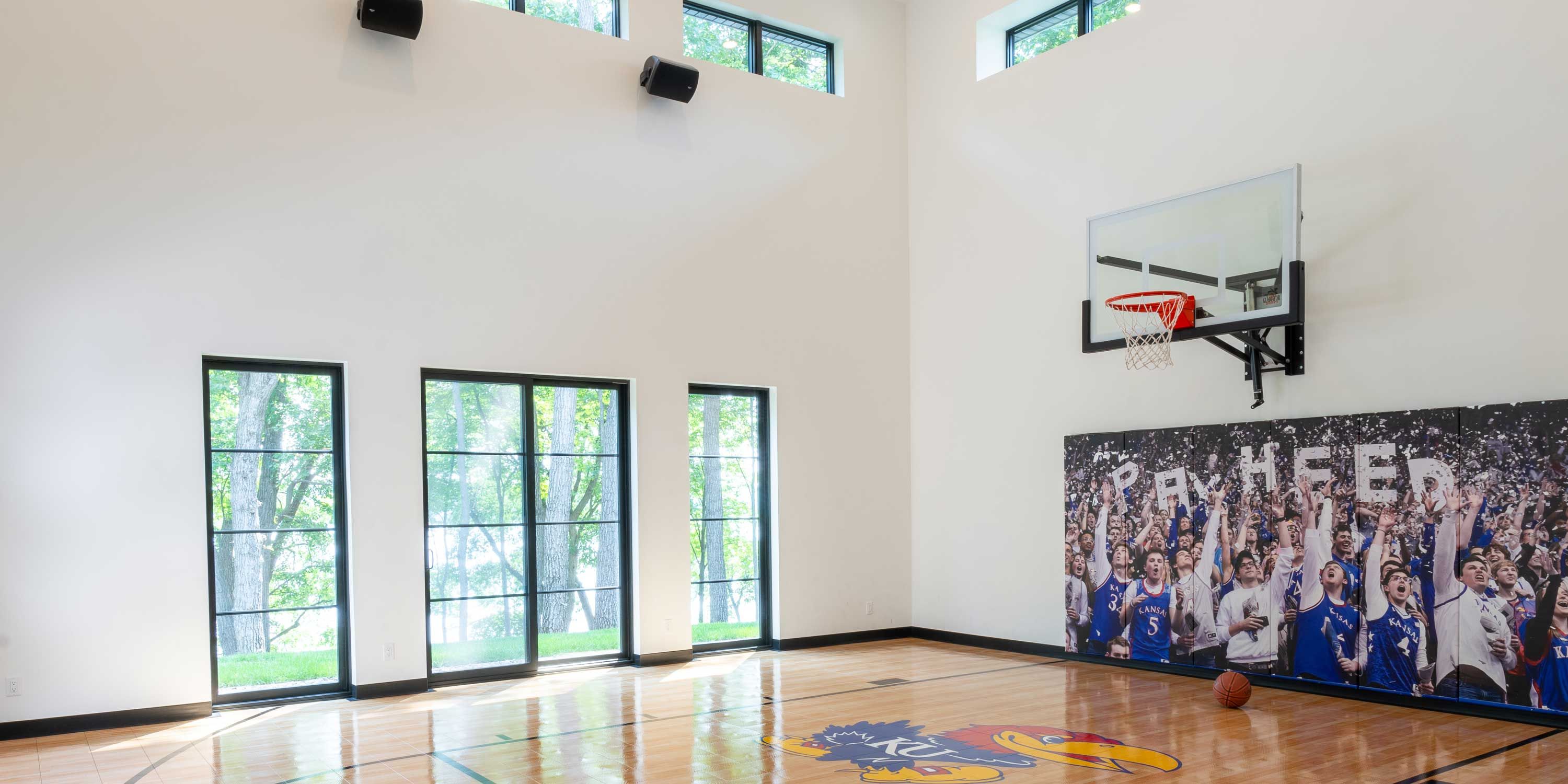 indoor basketball court with white walls