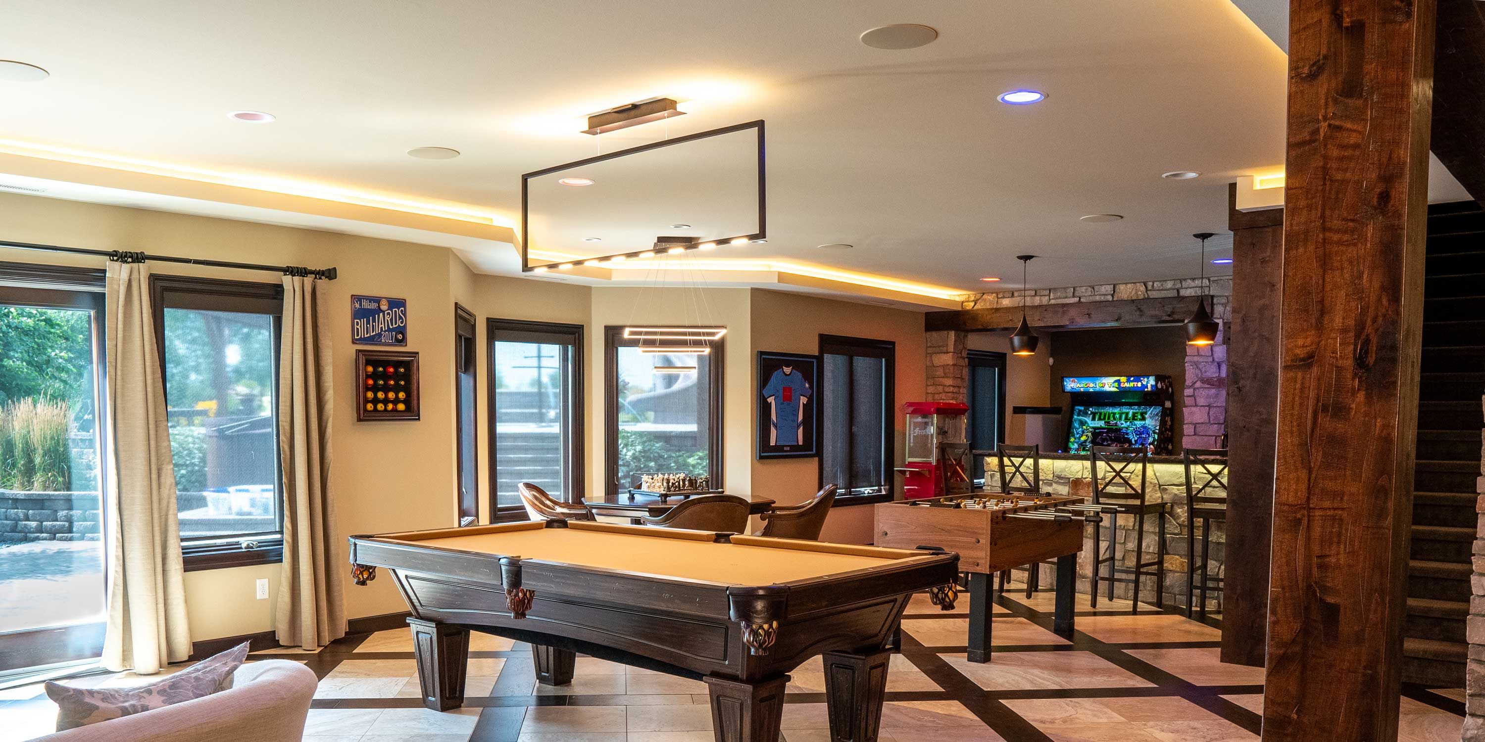 bar and game room with a large projector screen from sony and a wine bar